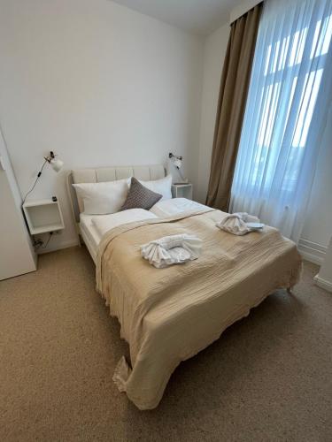 Een bed of bedden in een kamer bij Hotel Villa Klasen