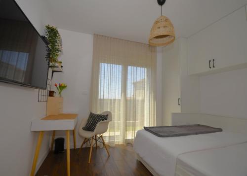 Postel nebo postele na pokoji v ubytování Apartman Barry