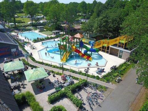 an aerial view of a water park with two pools at Chalet Pallegarste 125 in Mariënberg