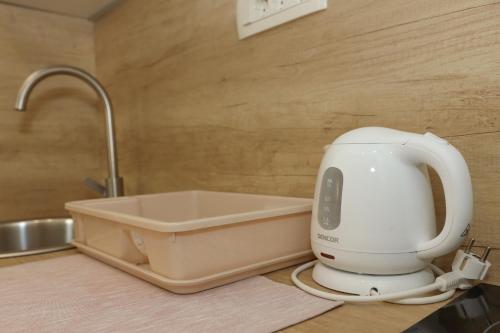 a mixer sitting on a counter next to a sink at Apartments Milanović in Herceg-Novi