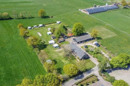 an aerial view of a farm with a group of vehicles at Camping De Nieuwe Hof in Otterlo