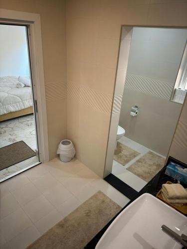 a bathroom with a shower and a toilet and a sink at Rashed Farm in Al Rahba
