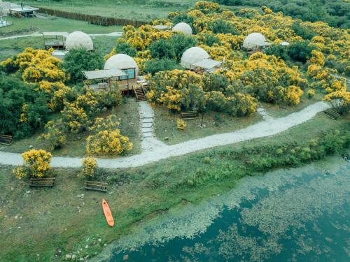 an aerial view of an island with domes at Glamping Puente Blanco in Sierra de la Ventana