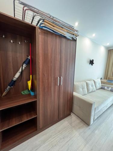 a small bedroom with a bed and a closet at Dom Wczasowy Korona in Rewal