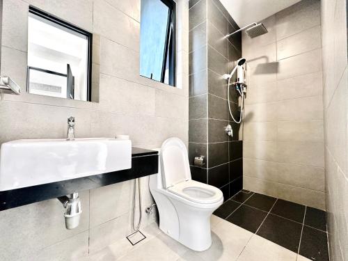 a bathroom with a sink and a toilet at Georgetown Classic Collection 3BR-10PAX in George Town