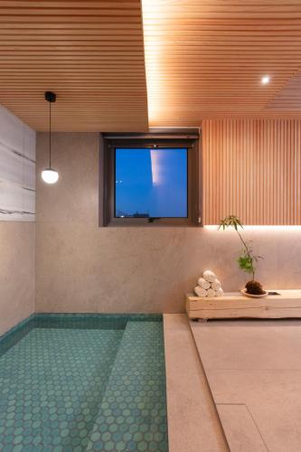 a swimming pool with a television in a room at PBr7 Hotel Unusual Stay in Gyeongju