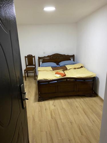 a bedroom with a bed and a wooden floor at дом в старом тбилиси in Tbilisi City