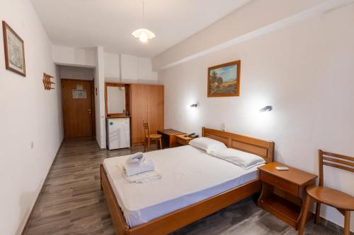 Postel nebo postele na pokoji v ubytování Ξενοδοχείο Μούσες - Hotel Muses