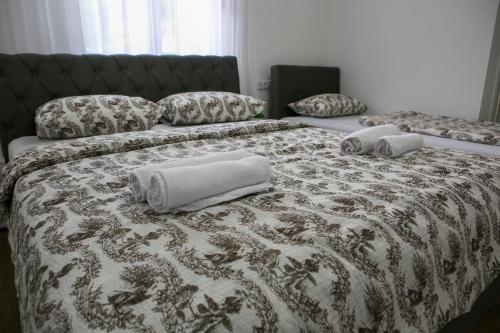 Ένα ή περισσότερα κρεβάτια σε δωμάτιο στο Apartments and Rooms La Vida