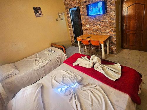Postel nebo postele na pokoji v ubytování Dafina Hotel