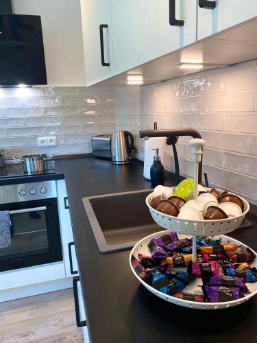 a kitchen counter with a bowl of food on it at Penthouse - Zentral und Genial in Passau