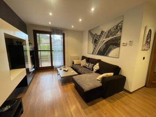 a living room with a couch and a table at Casa Mati in Sorripas