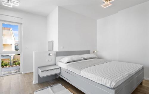 En eller flere senge i et værelse på Apartments Adriatic