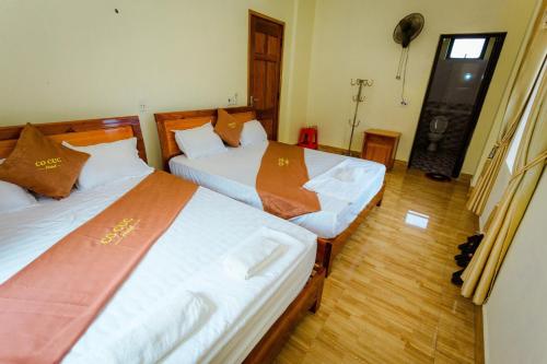 Postel nebo postele na pokoji v ubytování Hotel CÔ CÚC