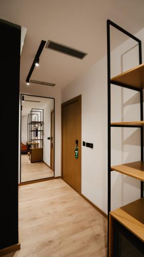 an empty room with a door and a hallway at BAZ'HUR Boutique Hotel in Kukës