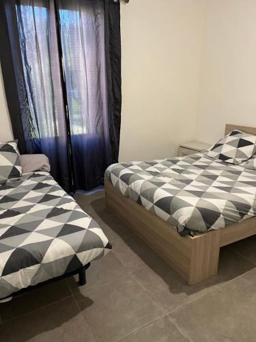 מיטה או מיטות בחדר ב-la maison de laligier