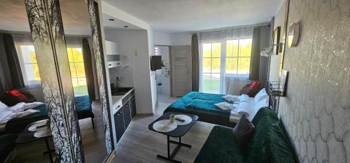 Ένα ή περισσότερα κρεβάτια σε δωμάτιο στο Apartamenty Hexagon nr 1