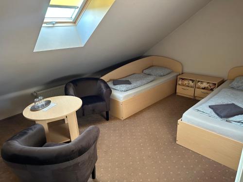 En eller flere senge i et værelse på Žilina
