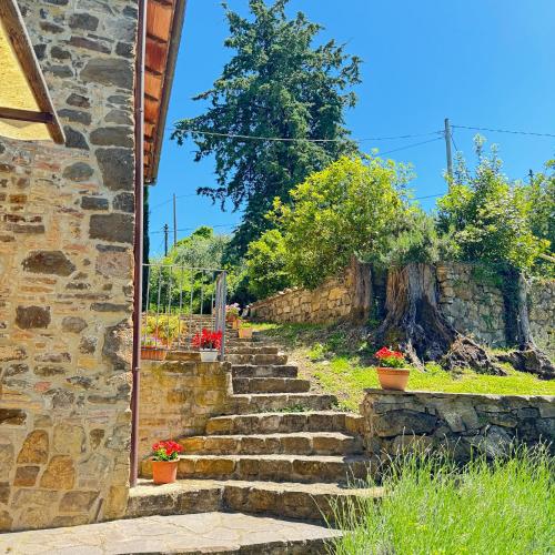 a set of stone stairs outside of a stone building at B&B Podere Cottimellino - Montalcino - Val d'Orcia in Montalcino