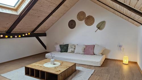 a living room with a couch and a coffee table at Apartments Beck - Super Central in Sombor