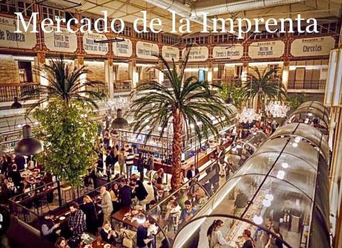 a crowd of people walking around a shopping mall at Elegant Rooftop by F2 Rental Home in Valencia