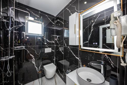 Koupelna v ubytování Hotel Murati