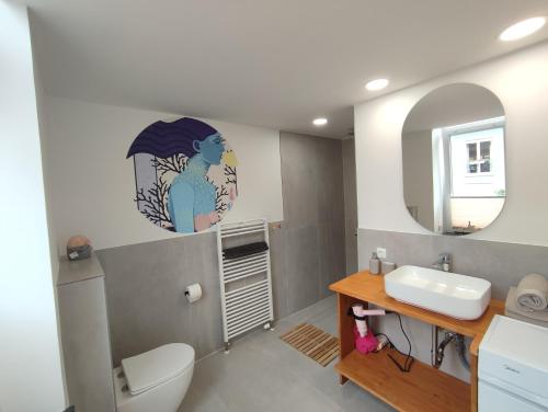 a bathroom with a sink and a mirror at Apartment 58- Ruhr Nah in Essen