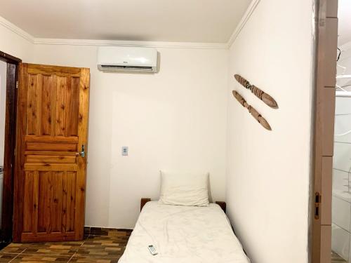 Giường trong phòng chung tại Chale Surf Natureza e Charme em Corumbau