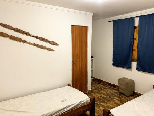 Giường trong phòng chung tại Chale Surf Natureza e Charme em Corumbau