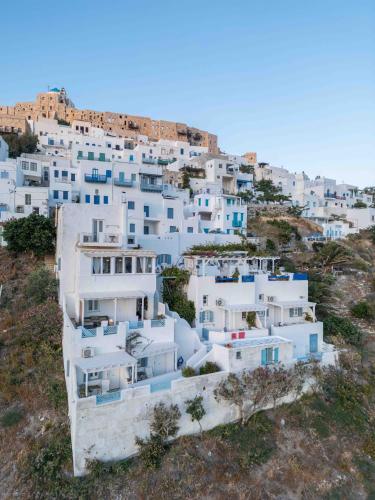 a group of white buildings on a hill at Studios Kilindra in Astypalaia Town