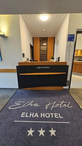 a hotel lobby with a welcome mat on the floor at Elha Hotel in Stuttgart