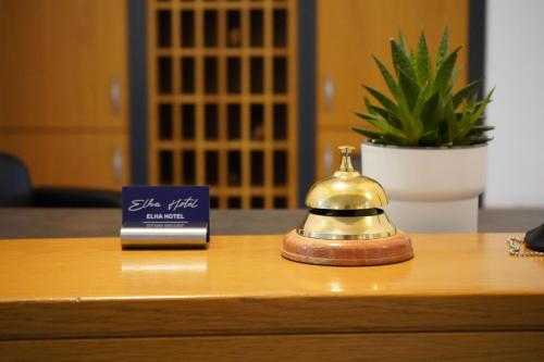 a tea kettle on a table next to a box at Elha Hotel in Stuttgart