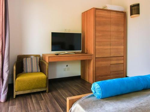 TV a/nebo společenská místnost v ubytování Villa Tranquilis