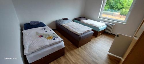 Een bed of bedden in een kamer bij TJ BANÍK OSTRAVA