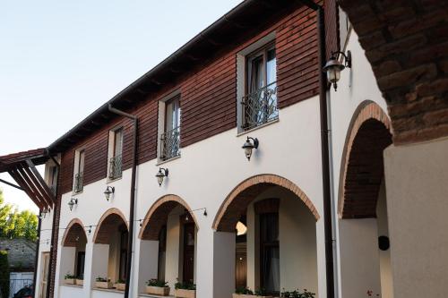a building with arches and windows on it at La Maison de Caroline in Alba Iulia