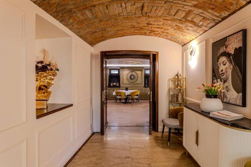 a hallway with a brick ceiling and a dining room at La Maison de Caroline in Alba Iulia