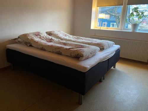 מיטה או מיטות בחדר ב-Central House