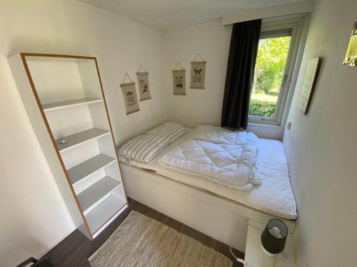 Un pat sau paturi într-o cameră la Puur Drenthe