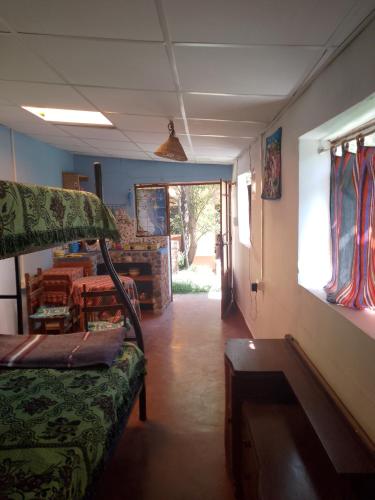 a living room with a couch and a window at Tony's House Eco Hostel in Huaraz