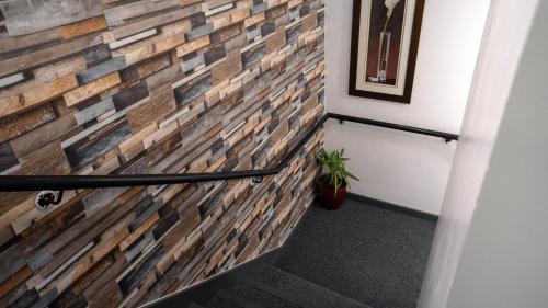 a faux brick wall in the hallway of a house at VR Apartments in Glasgow