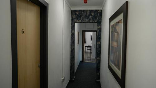 a hallway with a hallway leading into a room at VR Apartments in Glasgow