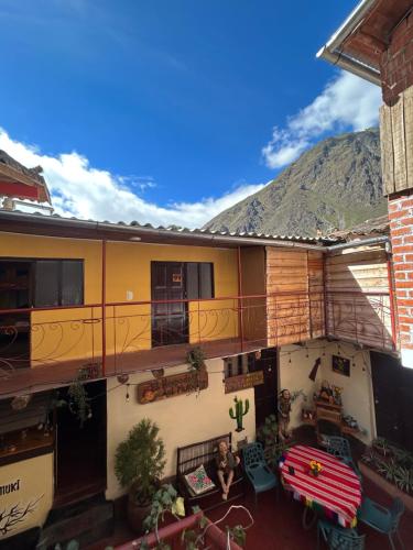 an apartment balcony with a view of a mountain at El Hospedaje del Muki in Ollantaytambo