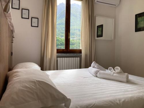 Ένα ή περισσότερα κρεβάτια σε δωμάτιο στο Villa Sasso Cavallo