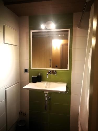 a bathroom with a sink and a mirror at La casa de Sara in Novés de Segre