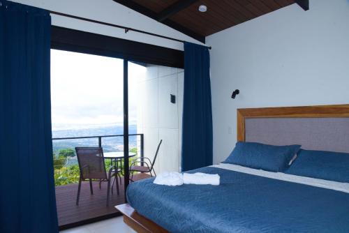 Giường trong phòng chung tại Hotel Colinas Altavista