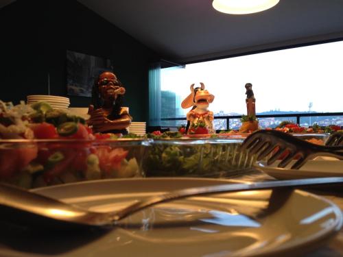 a plate of food on a table with a fork and knife at Atlıhan Hotel in Ordu