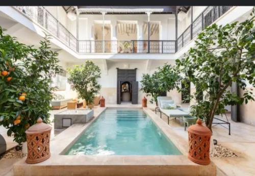 a large swimming pool in a large building at testingg in Zemmour Touirza