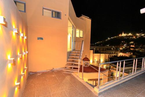 a balcony with stairs and a view of a city at Hotel Grand Guanajuato in Guanajuato