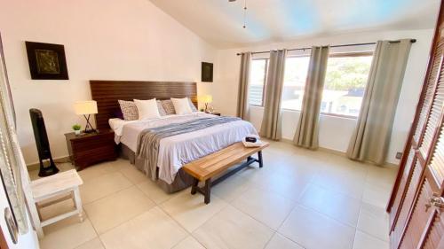 a bedroom with a bed and a large window at San Antonio Villas in San Antonio
