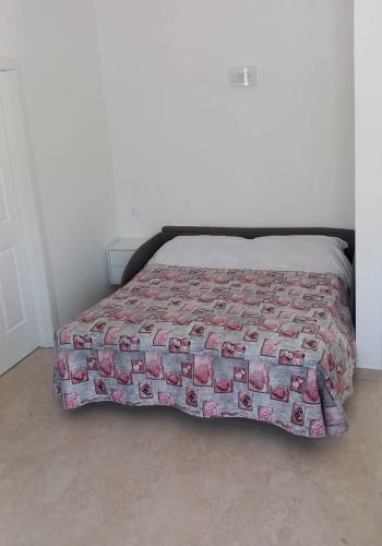 a bed with a bunch of dollar bills on it at Casa Luce in Marina di Massa